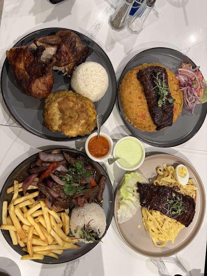 Peruvian dishes arranged on white plates.